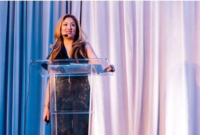 Cindy Keyes delivering presentation at corporate event