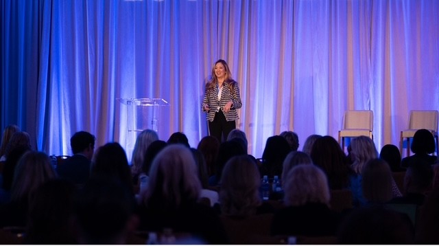 Cindy Keyes speaking on conference stage